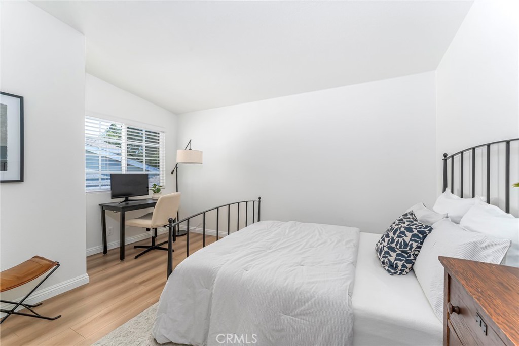 33144 Ocean Ridge Dana Point, CA 92629 - Photo 31 of 45 a bedroom with a bed a table and chair