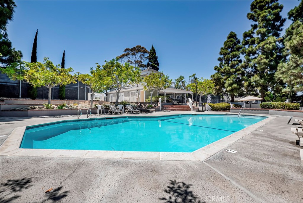 33144 Ocean Ridge Dana Point, CA 92629 - Photo 43 of 45 a view of a swimming pool with outdoor seating and plants