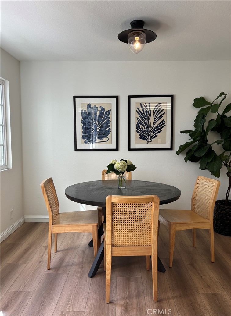 33144 Ocean Ridge Dana Point, CA 92629 - Photo 9 of 45 a view of a dining room with furniture and wooden floor