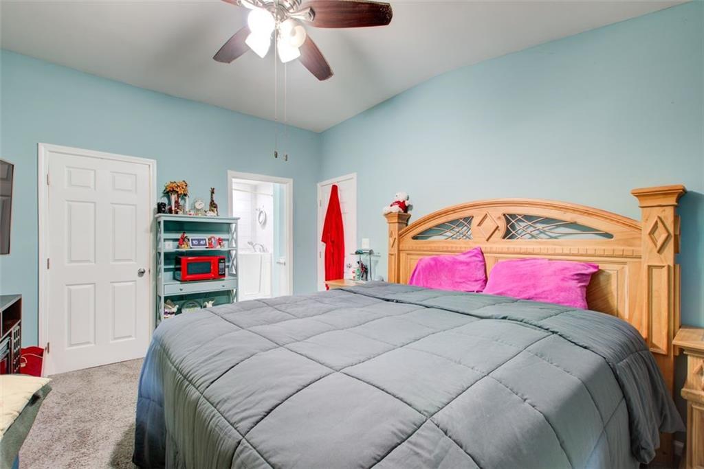 2619 Old Toney Road Ellenwood, GA 30294 - Photo 14 of 32 a bed room with a bed and a book
