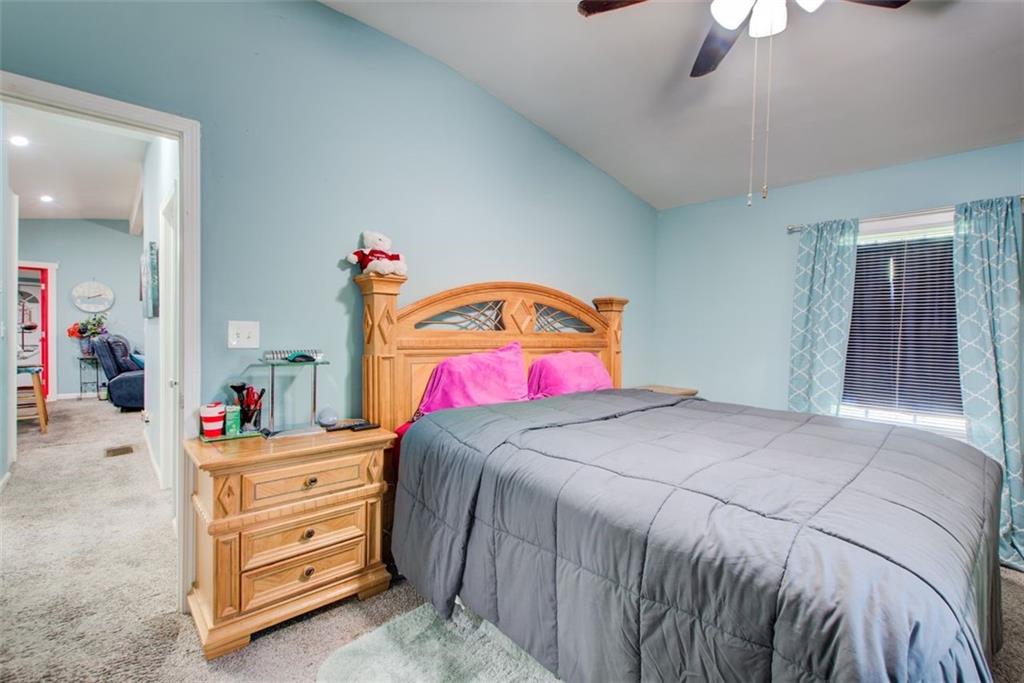 2619 Old Toney Road Ellenwood, GA 30294 - Photo 15 of 32 a bedroom with a bed and a dresser