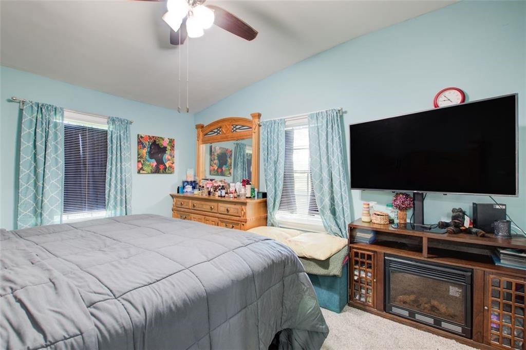 2619 Old Toney Road Ellenwood, GA 30294 - Photo 16 of 32 a bedroom with a bed and a flat screen tv