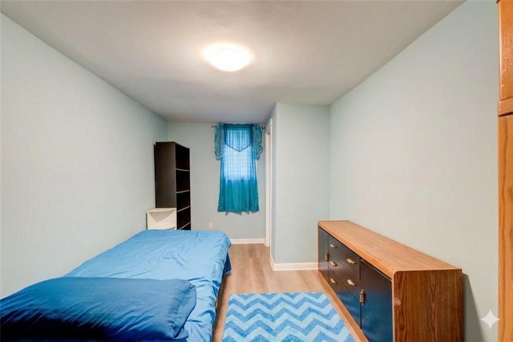 2619 Old Toney Road Ellenwood, GA 30294 - Photo 23 of 32 a bedroom with a bed and a lamp