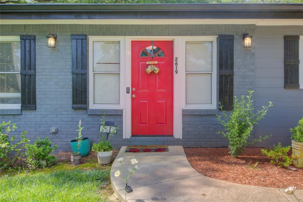 2619 Old Toney Road Ellenwood, GA 30294 - Photo 3 of 32 a front view of a house with garden