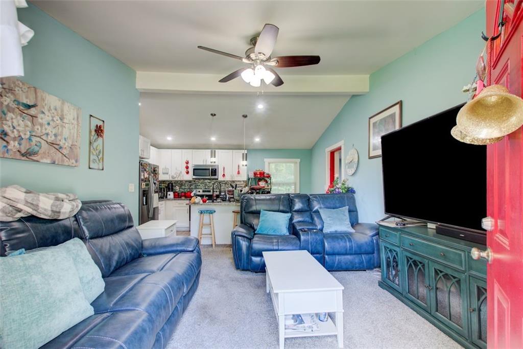 2619 Old Toney Road Ellenwood, GA 30294 - Photo 4 of 32 a living room with furniture and a flat screen tv