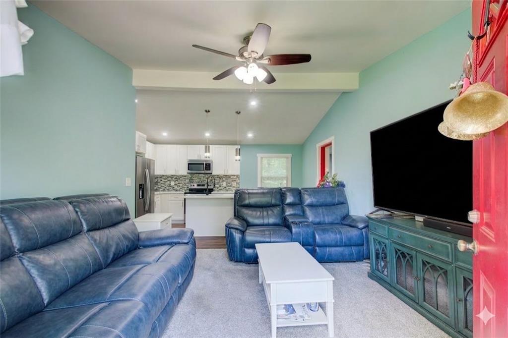 2619 Old Toney Road Ellenwood, GA 30294 - Photo 5 of 32 a living room with furniture and a flat screen tv