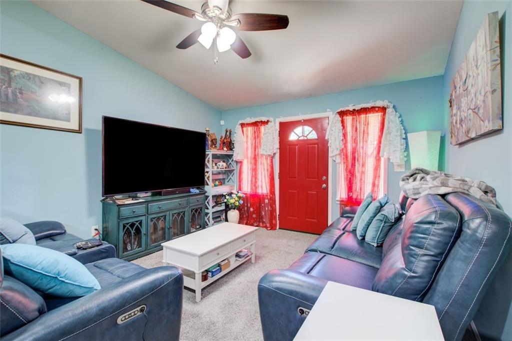 2619 Old Toney Road Ellenwood, GA 30294 - Photo 6 of 32 a living room with furniture and a flat screen tv