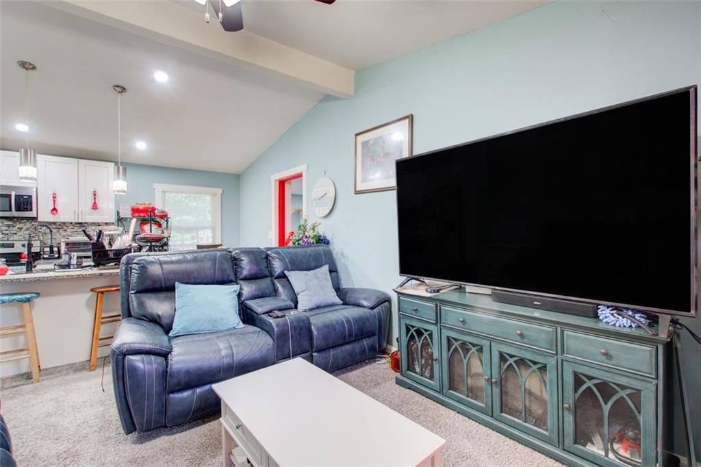 2619 Old Toney Road Ellenwood, GA 30294 - Photo 7 of 32 a living room with furniture and a flat screen tv