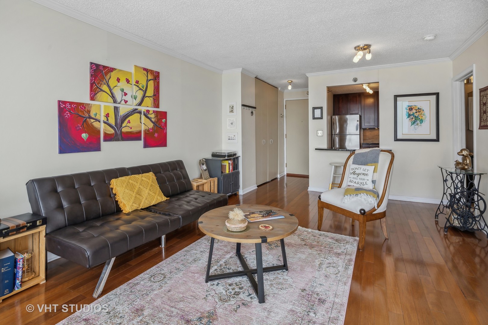 111 West Maple Street, Unit 3011 Chicago, IL 60610 - Photo 6 of 11 a living room with furniture a rug and a painting