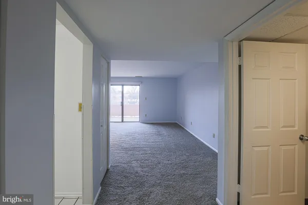 a view of an empty room and window