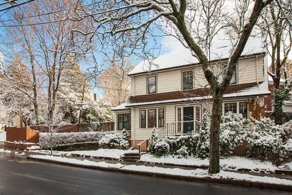 98 Clark Road Brookline, MA 02445 - Photo 1 of 12 a front view of a house with yard and trees around