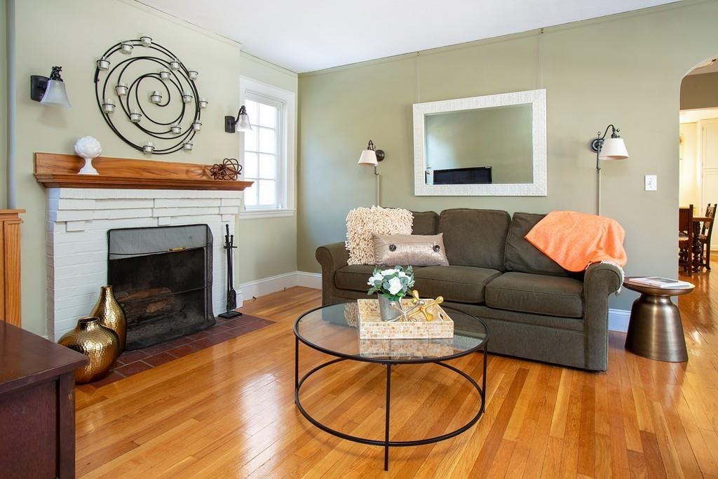 98 Clark Road Brookline, MA 02445 - Photo 2 of 12 a living room with furniture and a fireplace