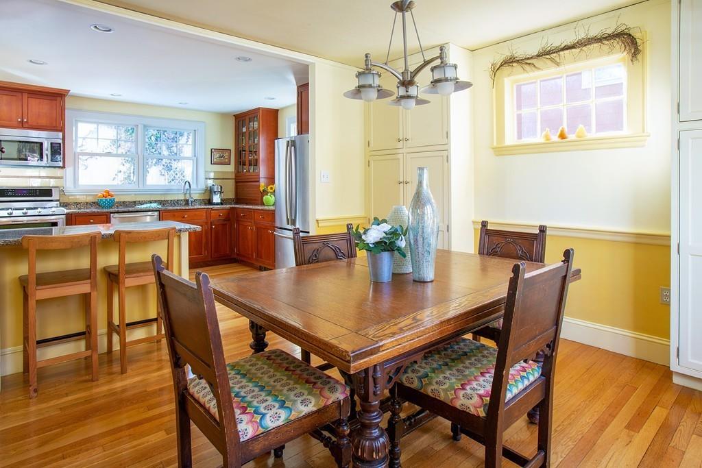 98 Clark Road Brookline, MA 02445 - Photo 5 of 12 a dining room with furniture a chandelier and wooden floor