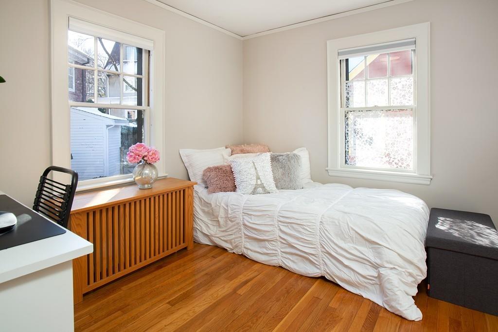 98 Clark Road Brookline, MA 02445 - Photo 9 of 12 a bedroom with a bed and a window