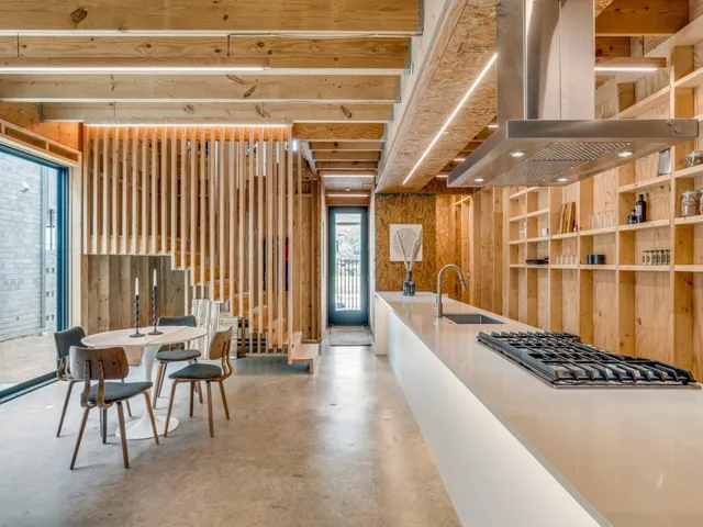 a lobby with furniture and a rug