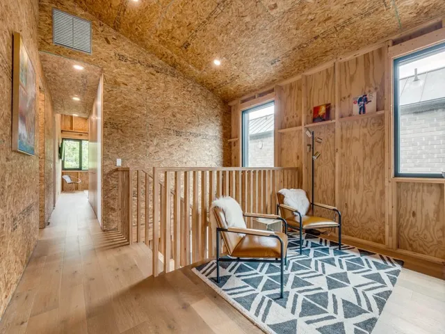 a backyard of a house with outdoor seating