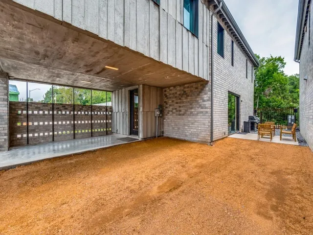 a view of a house with a backyard and balcony