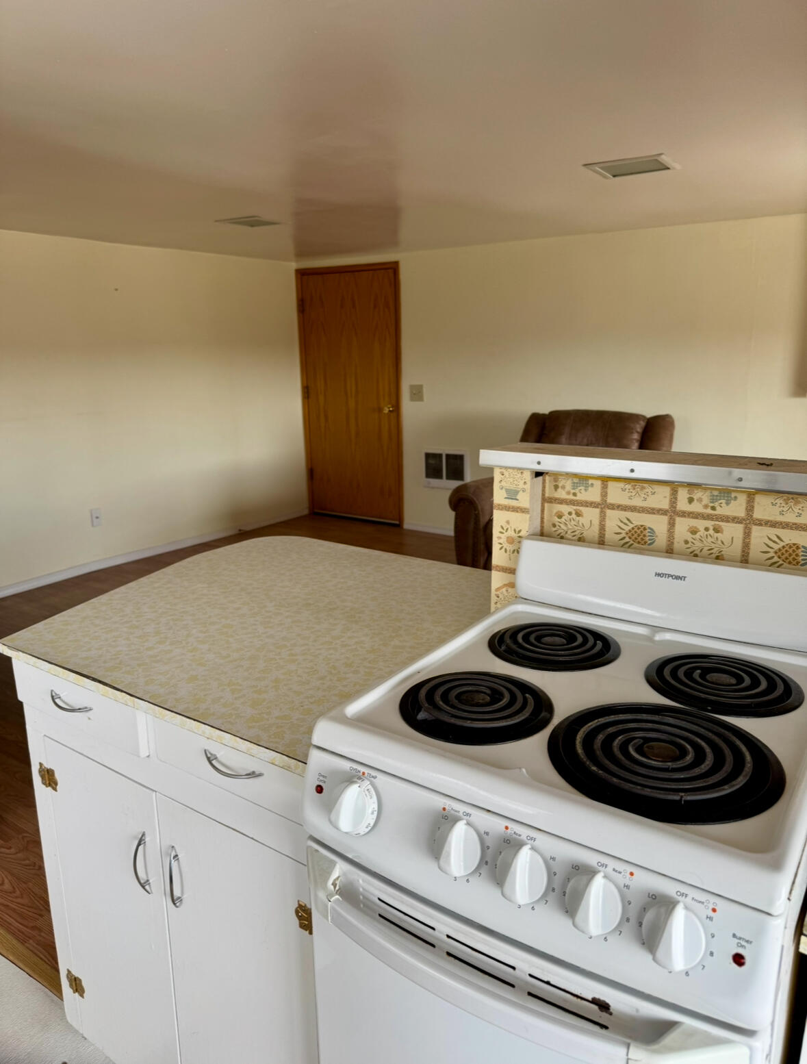 729 Southeast Grizzly Road Madras, OR 97741 - Photo 5 of 14 a kitchen with a stove and a microwave
