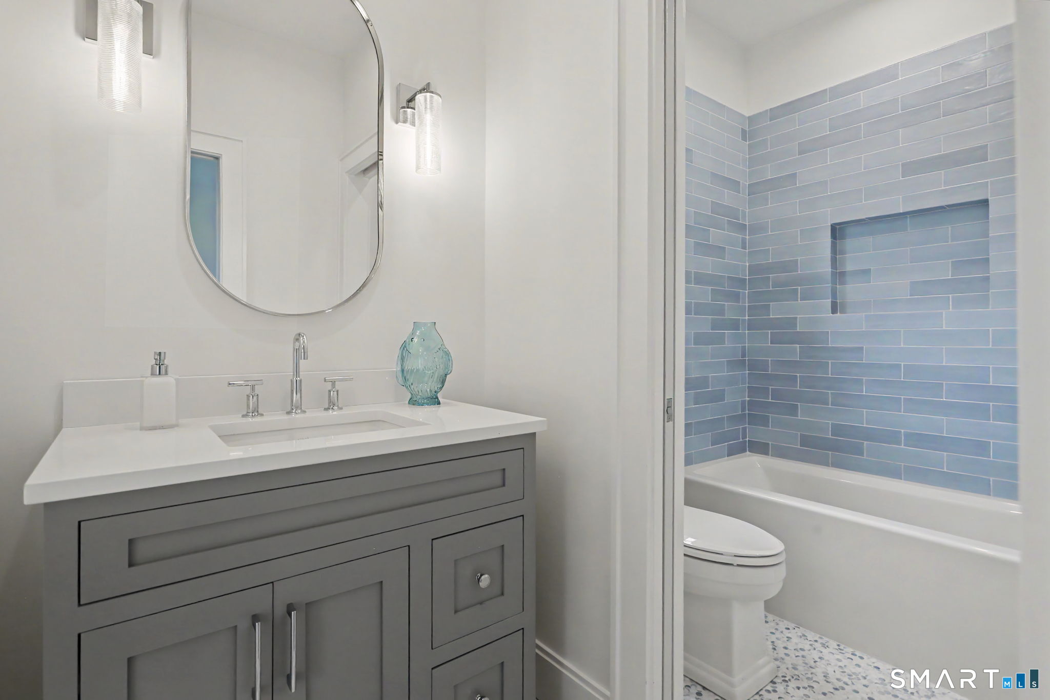 96 Clinton Street Fairfield, CT 06824 - Photo 16 of 34 a bathroom with a sink a toilet and shower