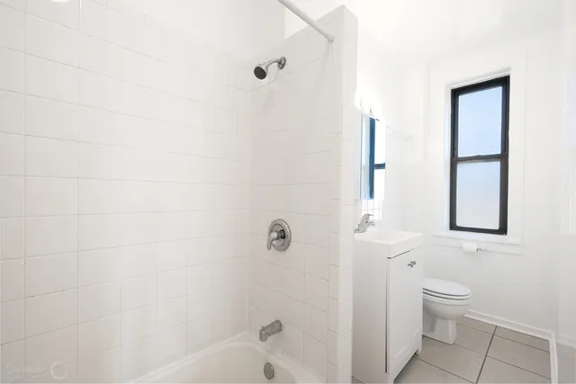 a bathroom with a toilet and a bathtub