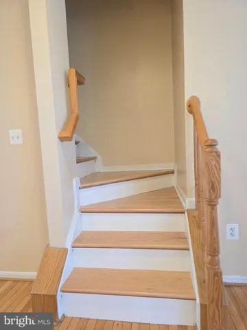 a view of staircase with white walls