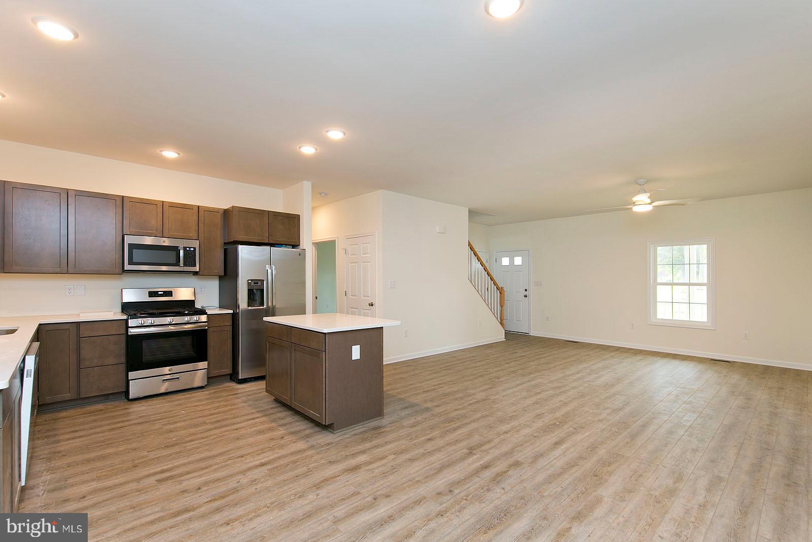 320 Pine Grove Road Bluemont, VA 20135 - Photo 16 of 28 a kitchen with stainless steel appliances a refrigerator and a stove top oven