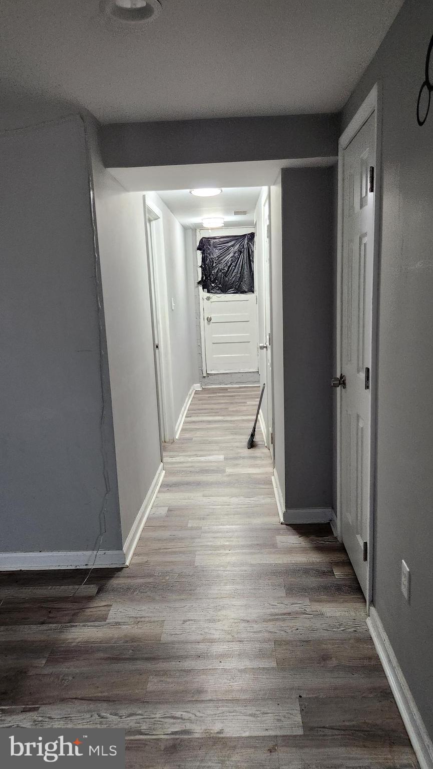 1024 Wicklow Road Baltimore, MD 21229 - Photo 35 of 44 a view of a hallway with wooden floor