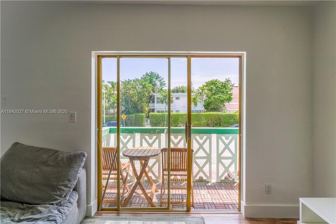 1234 Euclid Avenue, Unit 7 Miami Beach, FL 33139 - Photo 13 of 14 a living room with large windows