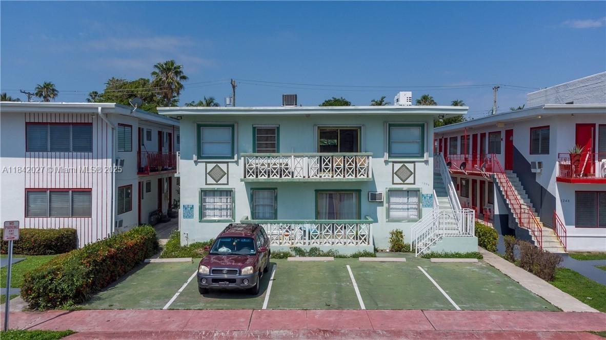 1234 Euclid Avenue, Unit 7 Miami Beach, FL 33139 - Photo 2 of 14 a front view of a house with garden