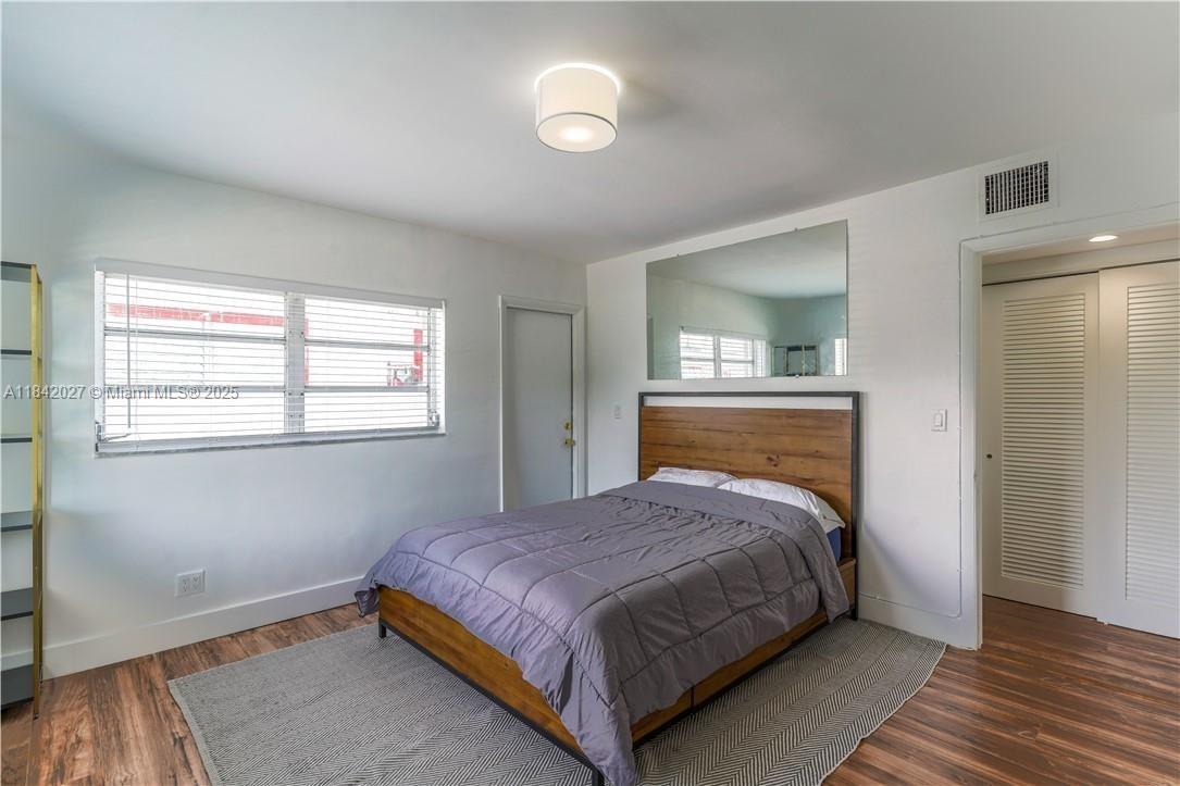 1234 Euclid Avenue, Unit 7 Miami Beach, FL 33139 - Photo 5 of 14 a bedroom with a bed and a window