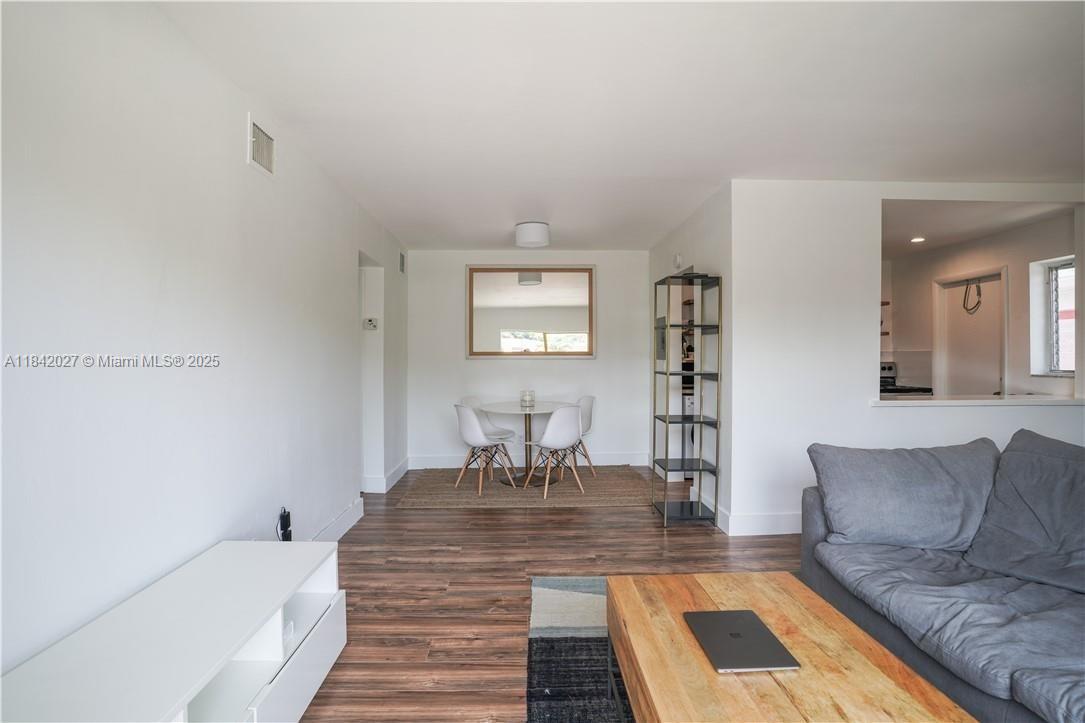 1234 Euclid Avenue, Unit 7 Miami Beach, FL 33139 - Photo 8 of 14 a living room with furniture and a rug