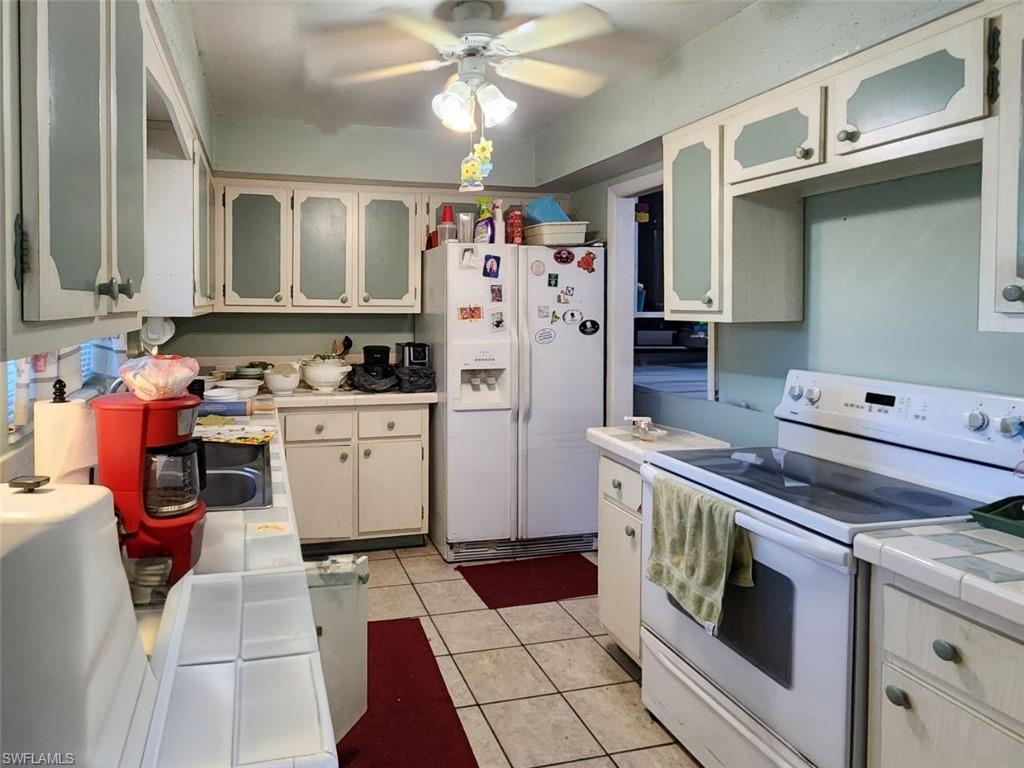 2625 Mohican Drive Melbourne, FL 32935 - Photo 2 of 8 a kitchen with a stove top oven and cabinets