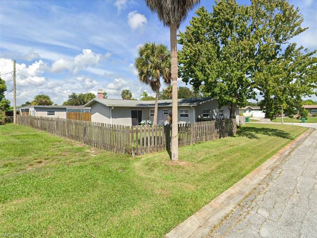 2625 Mohican Drive Melbourne, FL 32935 - Photo 8 of 8 a view of a house with a yard and sitting area