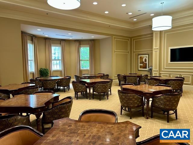 124 Stodghill Drive Ruckersville, VA 22968 - Photo 54 of 58 a view of a kitchen with a dining table and chairs