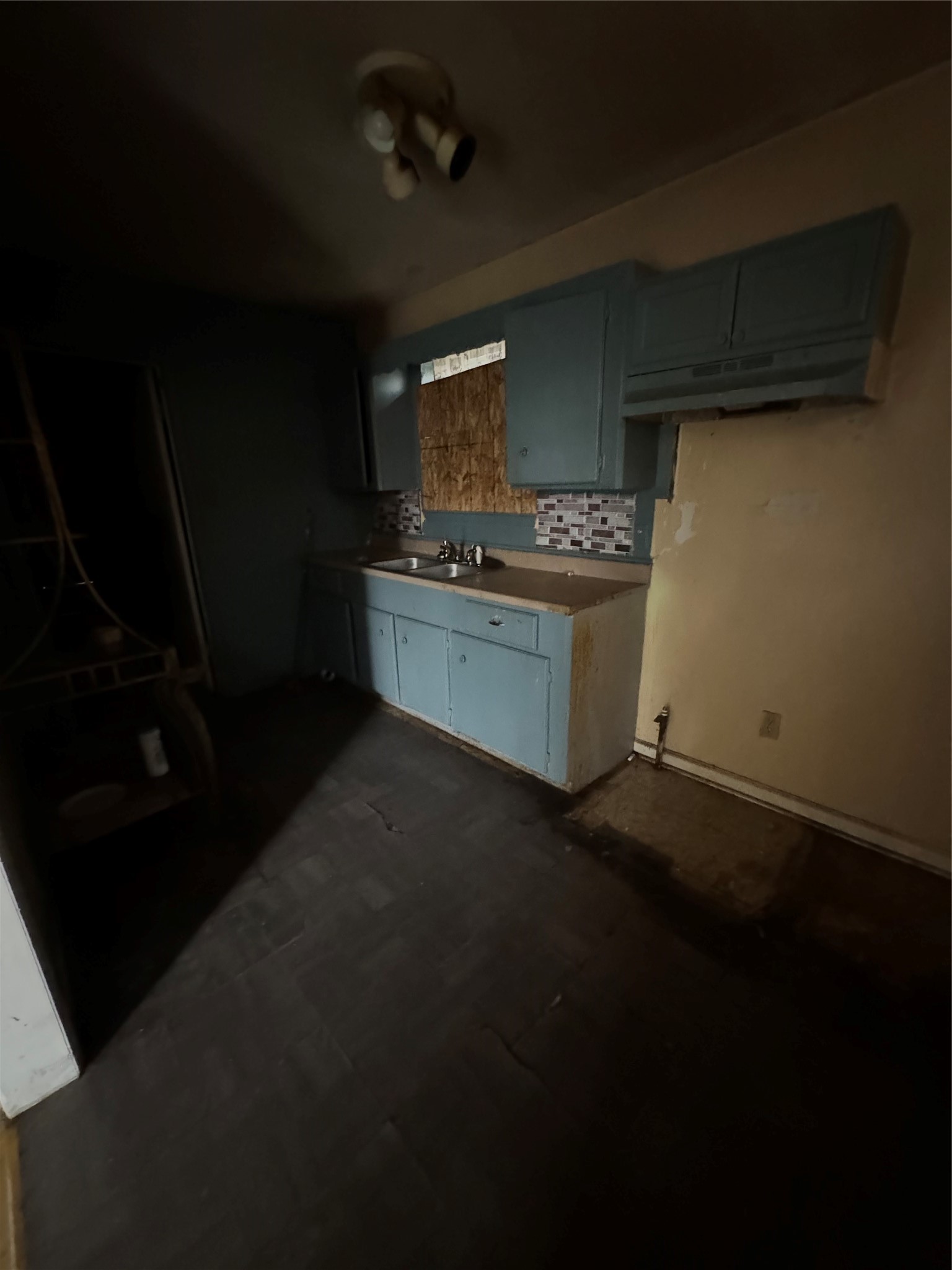 4710 Antha Street Houston, TX 77016 - Photo 4 of 11 a kitchen with a sink and cabinets