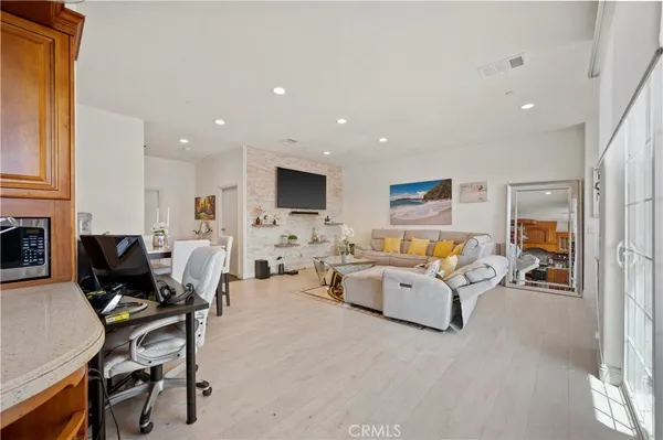 a kitchen with stainless steel appliances granite countertop a sink and cabinets