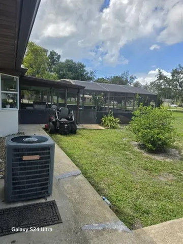 a kitchen with a sink a refrigerator and cabinets