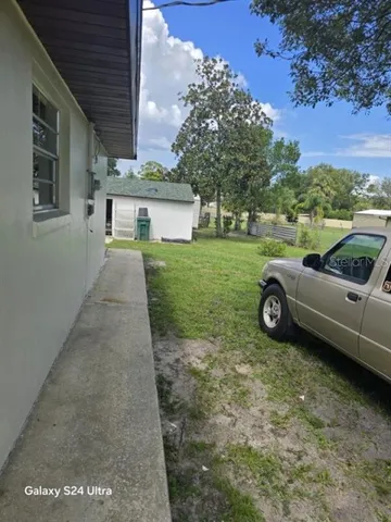 a kitchen with cabinets appliances a sink and a counter top space