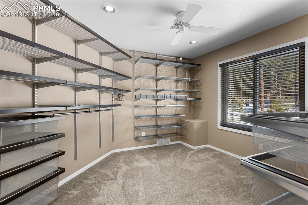 505 Cimarron Road Monument, CO 80132 - Photo 26 of 50 Primary bedroom walk-in closet. 1 of 2 closets