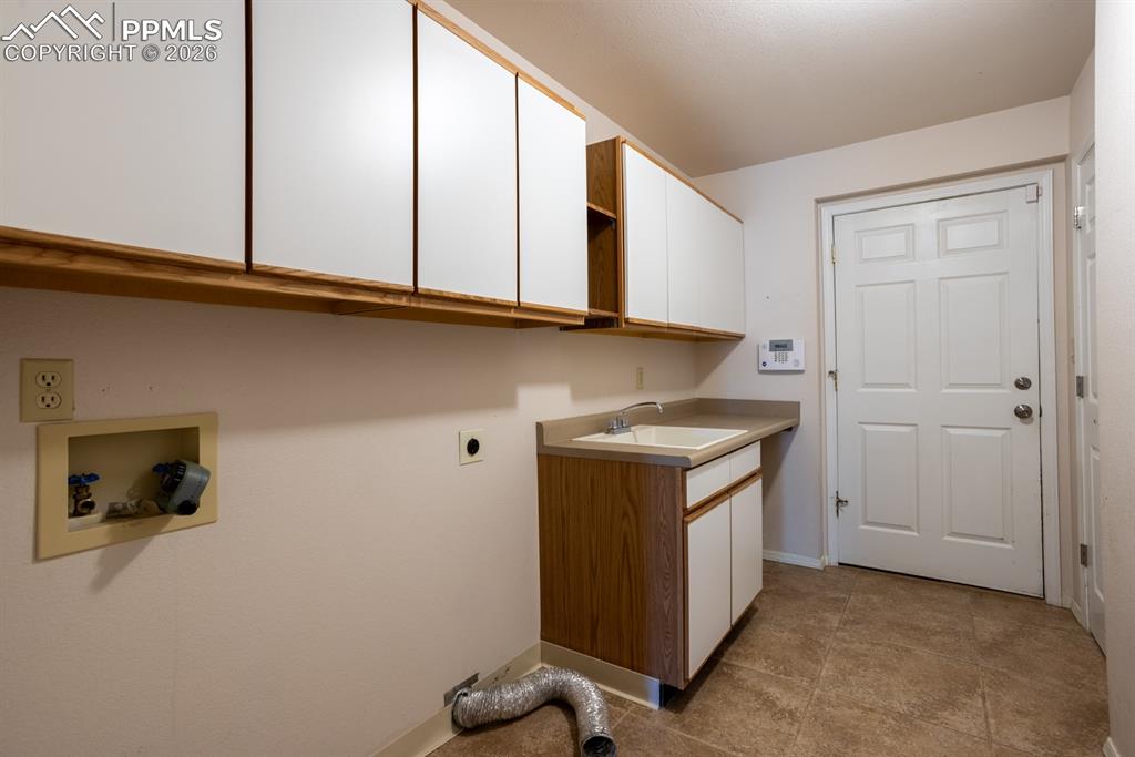 505 Cimarron Road Monument, CO 80132 - Photo 32 of 50 Main level laundry with door to garage