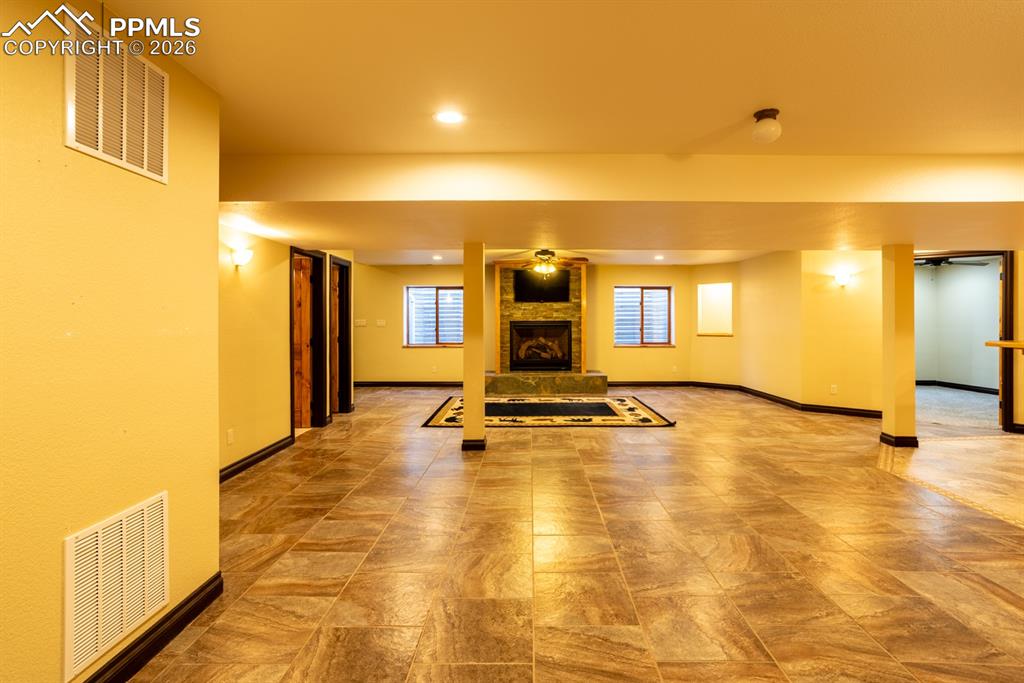 505 Cimarron Road Monument, CO 80132 - Photo 35 of 50 Basement family room, gas fireplace