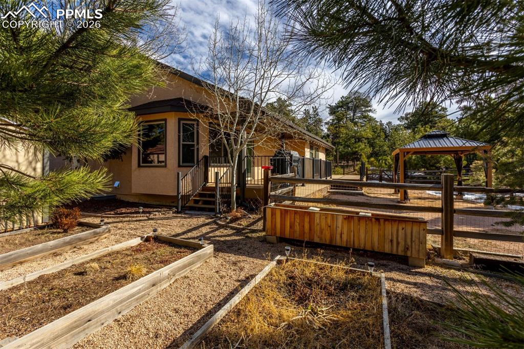 505 Cimarron Road Monument, CO 80132 - Photo 10 of 50 Raised garden beds, gazebo stays