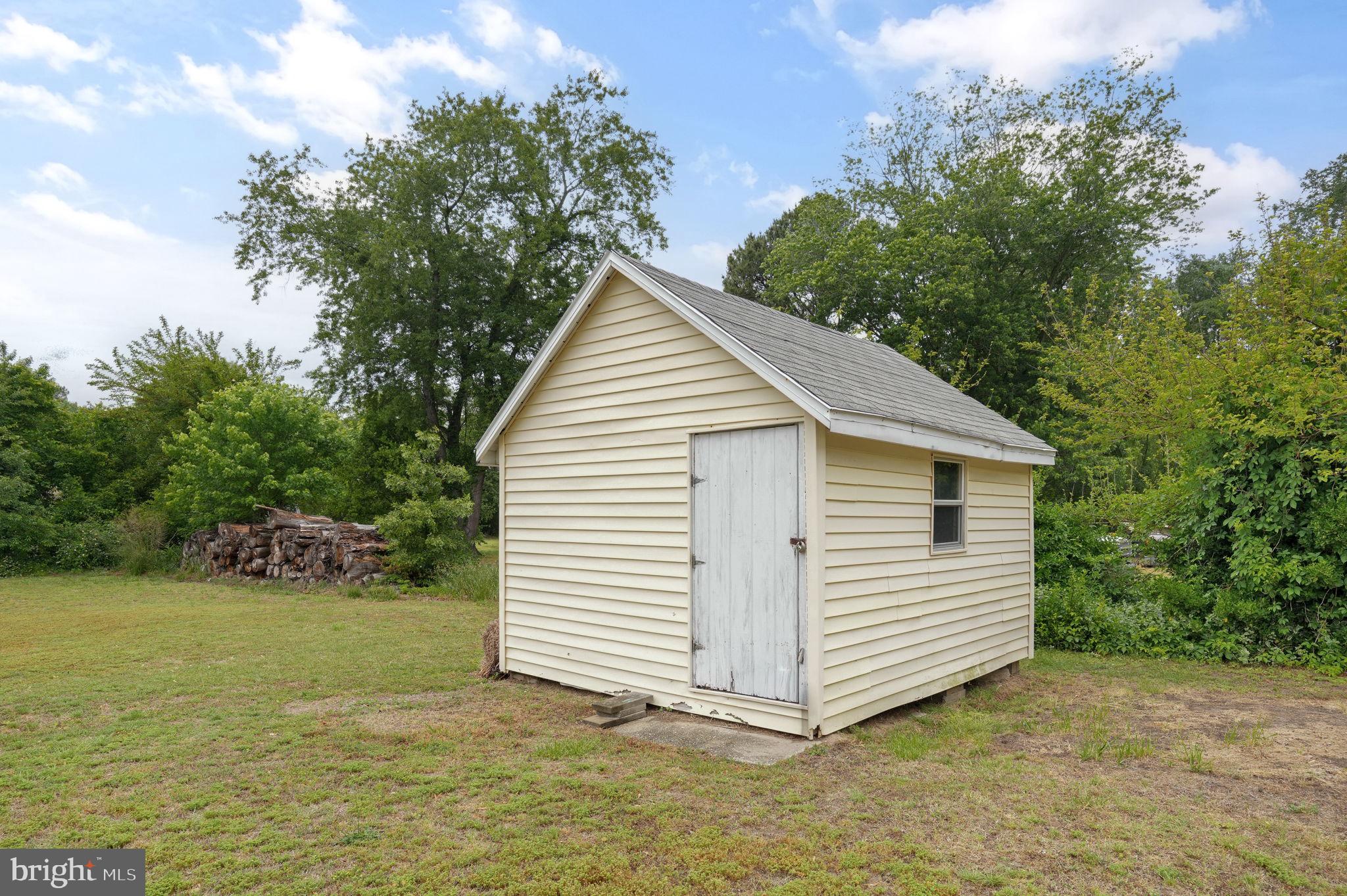 7278 Fleming Road New Church, VA 23415 - Photo 40 of 44 a view of a house with a yard