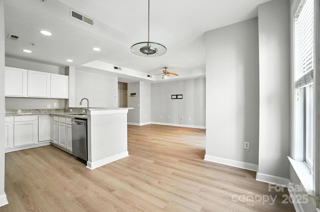 a view of a kitchen with wooden floor