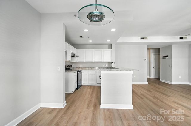 a view of a kitchen with a sink and dishwasher