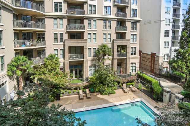 a kitchen with counter space dining table and chairs