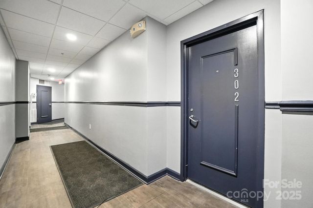 a view of a hallway with a refrigerator