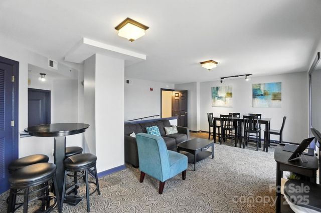 a kitchen with stainless steel appliances granite countertop a sink refrigerator and cabinets