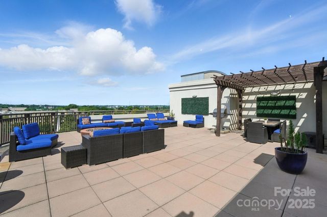 a view of a terrace with sitting area