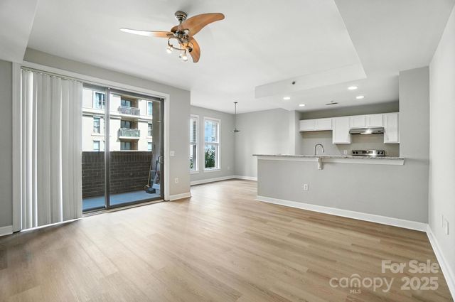 a view of wooden floor and windows in a room